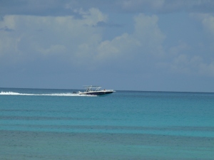 tour boat speeds past heading towards Exuma Palms